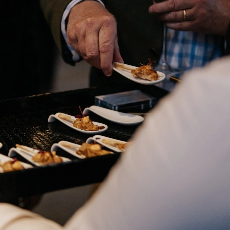 People helping themselves to appetizers at Thetford Farm Barn