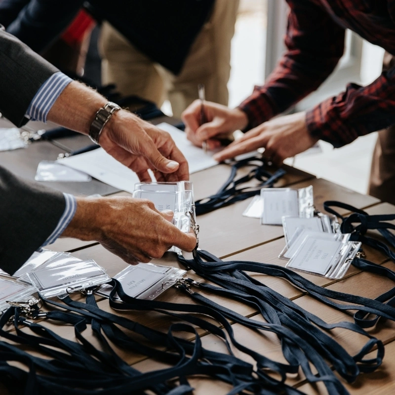 People taking their name badge
